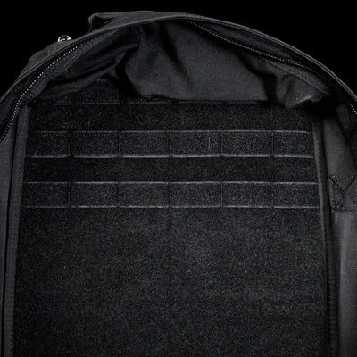 Close-up of the GR1 Shooter 26L - Built by Scars backpack interior, made with Special Forces Grade CORDURA®, showcasing multiple horizontal Velcro straps and a zippered edge.