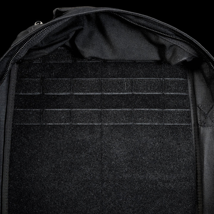 Close-up of the GR1 Shooter 26L - Built by Scars backpack interior, made with Special Forces Grade CORDURA®, showcasing multiple horizontal Velcro straps and a zippered edge.