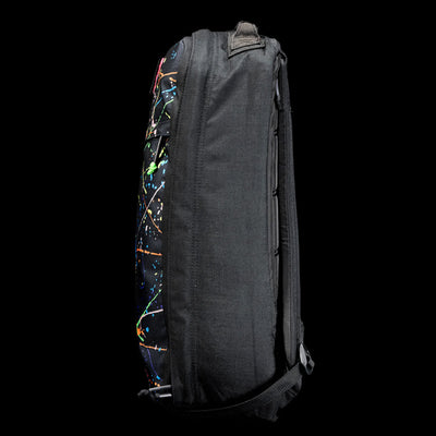 Side view of the GR1 Shooter 26L - Built by Scars, a black backpack made from Special Forces Grade CORDURA®, showcasing a bold paint splatter design on the front.