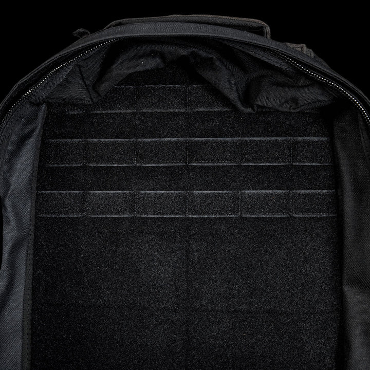 The open, empty GR1 Shooter 26L - Built by SCARS backpack features a velcro-lined interior with horizontal attachment strips, made from Special Forces Grade CORDURA®—perfect for any mission.