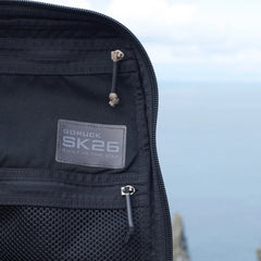 Open black GR1 USA Slick backpack made from ballistic nylon Cordura, showcasing Special Forces-grade quality, with a "Built in the USA" patch, set against a blurred outdoor background.