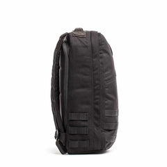 Black GORUCK tactical rucksack side view with durable fabric and MOLLE webbing for rugged outdoor gear