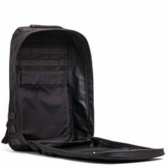 Open black tactical GORUCK rucksack showing organized interior with compartments and MOLLE webbing