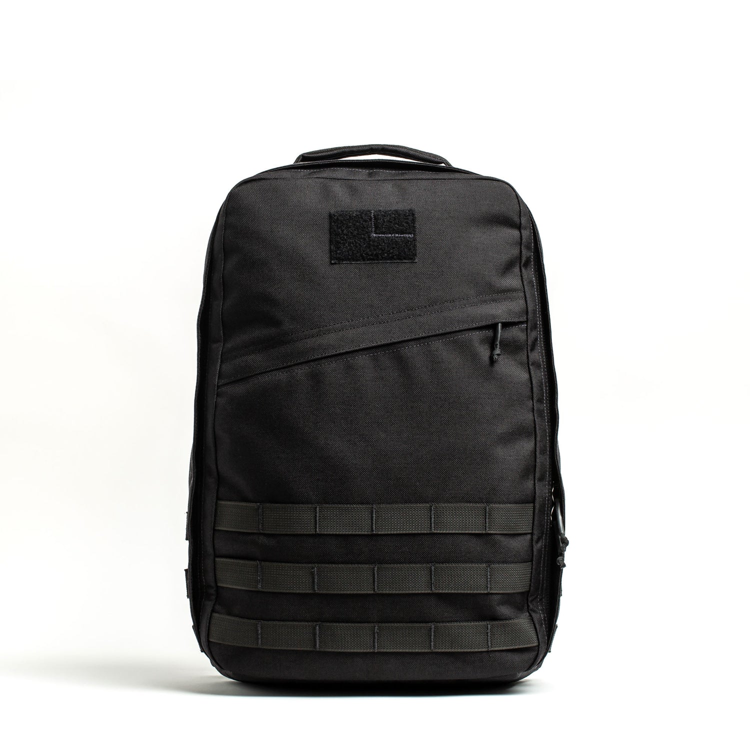 A black GR1 USA - Cordura rucksack with a top handle, front zipper pocket, and MOLLE webbing is displayed on a white background—a true Special Forces backpack.