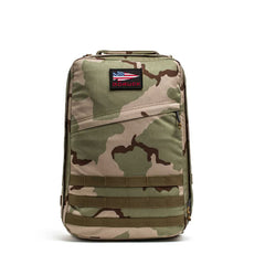 The GR1 USA - Cordura, an American-made backpack built to Special Forces grade standards, features camouflage design, an American flag patch, and a "GORUCK" label on the front against a white background.