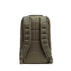 The GR1 USA - Cordura rucksack in green is shown from the back, featuring padded shoulder straps and a cushioned back panel.
