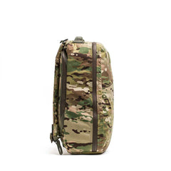 Side view of a GORUCK tactical rucksack in multicam camo with durable zippers on white background
