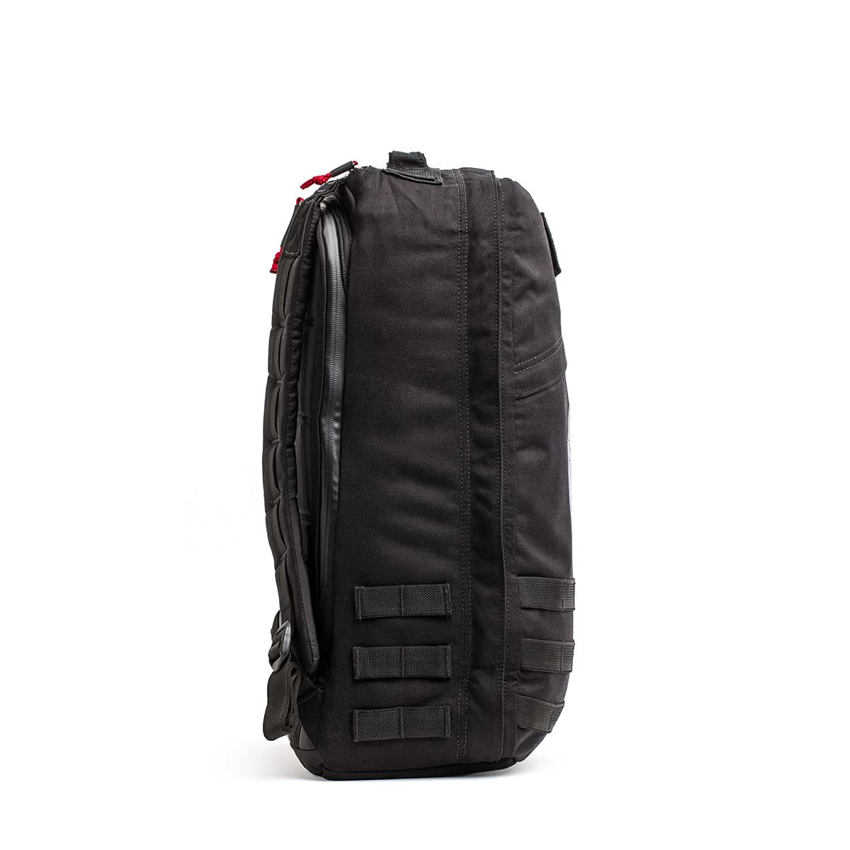 The 26L GR1 USA - GORUCK x Arnold's Pump Club stands upright, side view shown with straps and webbing—this limited-edition backpack is proudly built in the USA.