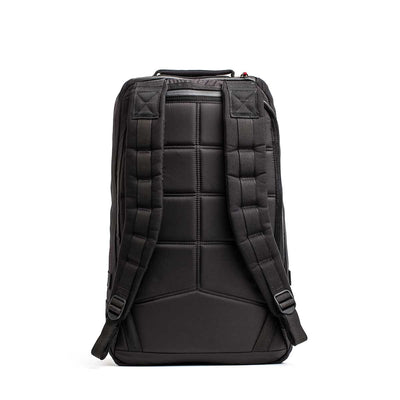 The 26L GR1 USA - GORUCK x Arnold's Pump Club backpack, shown from the back, features padded straps and a textured, cushioned back panel. This limited-edition pack is inspired by the classic GR1 rucksack.