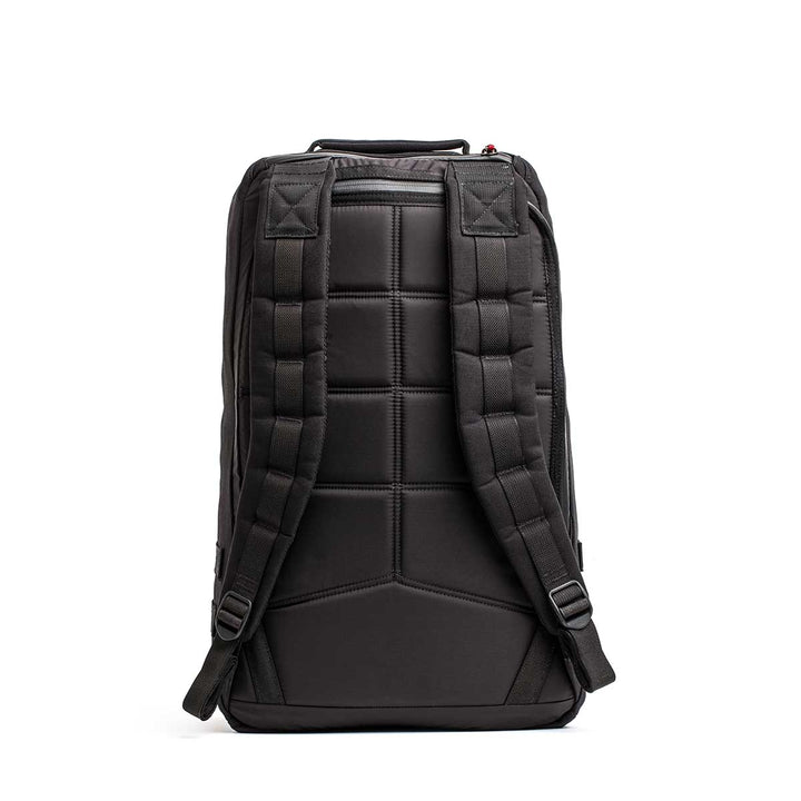 The 26L GR1 USA - GORUCK x Arnold's Pump Club backpack, shown from the back, features padded straps and a textured, cushioned back panel. This limited-edition pack is inspired by the classic GR1 rucksack.