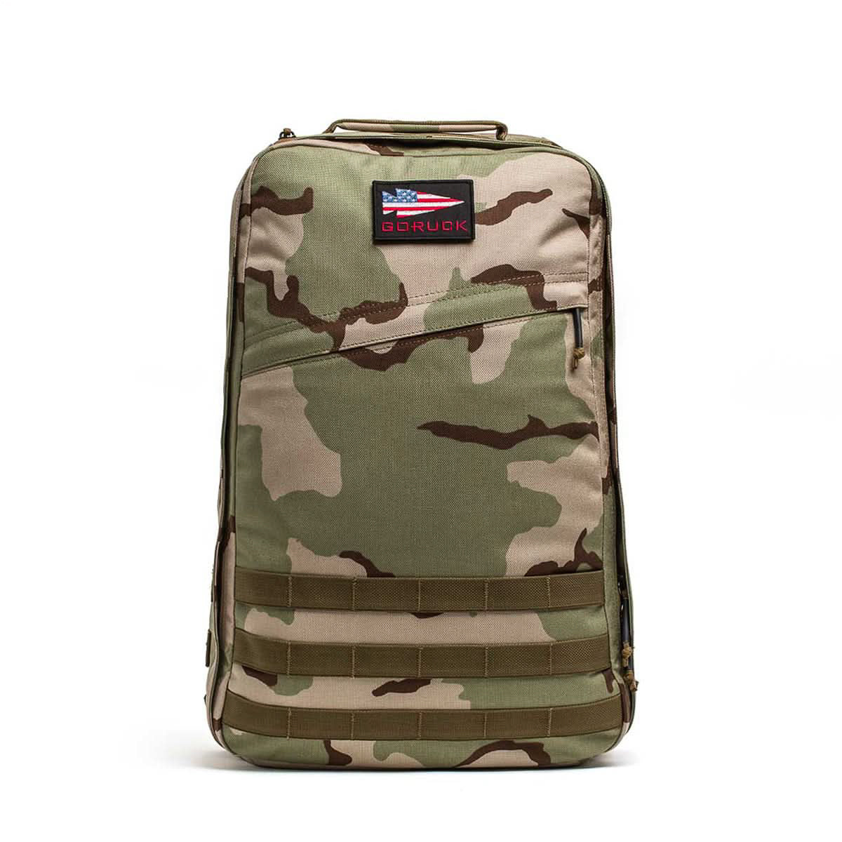 The GR1 USA - Cordura, an American-made camouflage rucksack, features a GORUCK patch and small American flag, making it stand out on a white background.