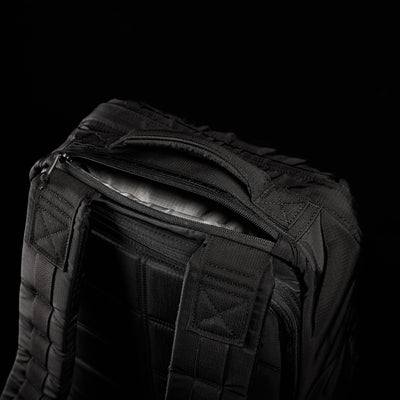 The GR1 USA - Ripstop ROBIC® is a black tactical backpack made from ultra-lightweight 420D Robic® Ripstop Nylon, featuring a rugged handle and stitching against a dark background.