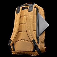Coyote brown GORUCK backpack with padded straps and back panel, laptop partially zipped in side pocket
