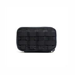 The GR1 Field Pocket - Waxed Canvas, a black tactical pouch with front MOLLE webbing, is displayed against a plain white background.