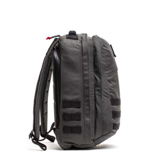 Side view of a gray GR2 - Cordura ruck with padded straps and horizontal webbing loops, perfect as a Special Forces backpack or carry-on travel bag.