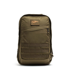 The GR2 - Cordura backpack, inspired by Special Forces rucksacks, comes in olive green and features a front zipper, patch, and multiple rows of webbing on the lower front.