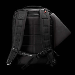 GORUCK black backpack rear view with padded straps and laptop sleeve on black background