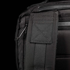 Close-up of durable black GORUCK rucksack strap and stitching, rugged rucking gear