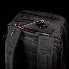GORUCK black rucking backpack with phone in zippered pocket, durable straps, gear detail
