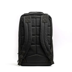 Black GORUCK backpack back view with padded shoulder straps and quilted back panel on white background