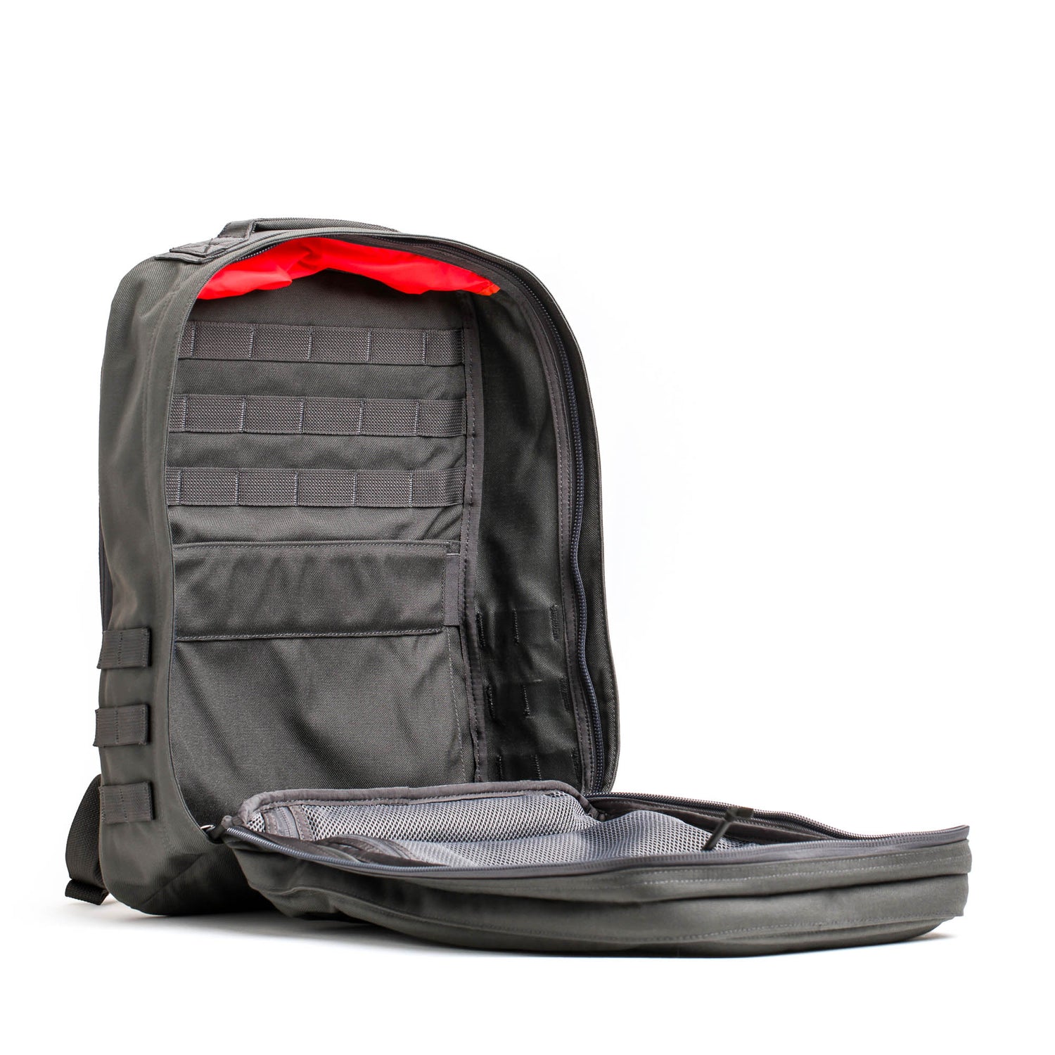 Open black GR2 - Cordura ruck with a bold red interior reveals multiple pockets and compartments—an ideal travel backpack inspired by Special Forces, showcased on a clean white background.