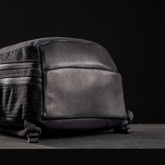 Close-up of the bottom of a black GORUCK Samurai 2.0 rucksack with durable fabric and padded base