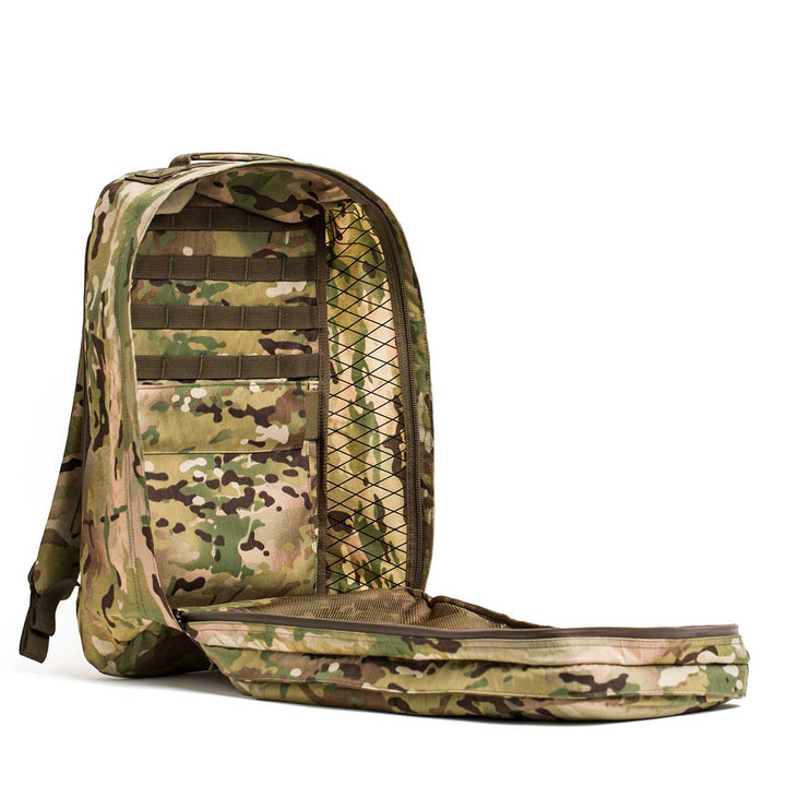 The GR2 X-PAC is a camo-patterned backpack featuring AquaGuard zippers and a zippered front that opens to reveal a waterproof inner mesh pocket and multiple storage compartments.