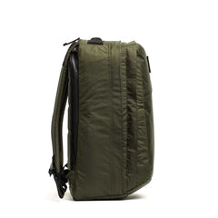 Side view of GORUCK rugged 34L rucksack in dark green with XPAC fabric and stash pocket