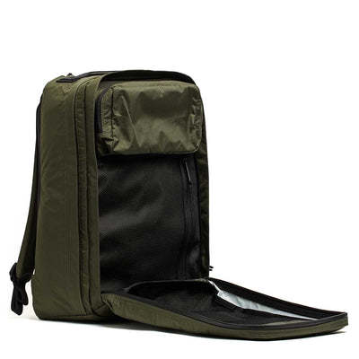 The GR2 X-PAC backpack in olive green features AquaGuard zippers, an unzipped front compartment, and showcases interior pockets with a mesh organizer.