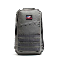 A gray GR2 USA - Cordura carry-on rucksack features a small American flag patch and “GORUCK” logo on the front—built tough like a Special Forces bag.