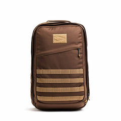 The GR2 - Ballistic Nylon Cordura is a rugged brown tactical travel bag with beige straps and a zippered front pocket, stands upright on a white background, and is carry-on compliant for your next adventure.
