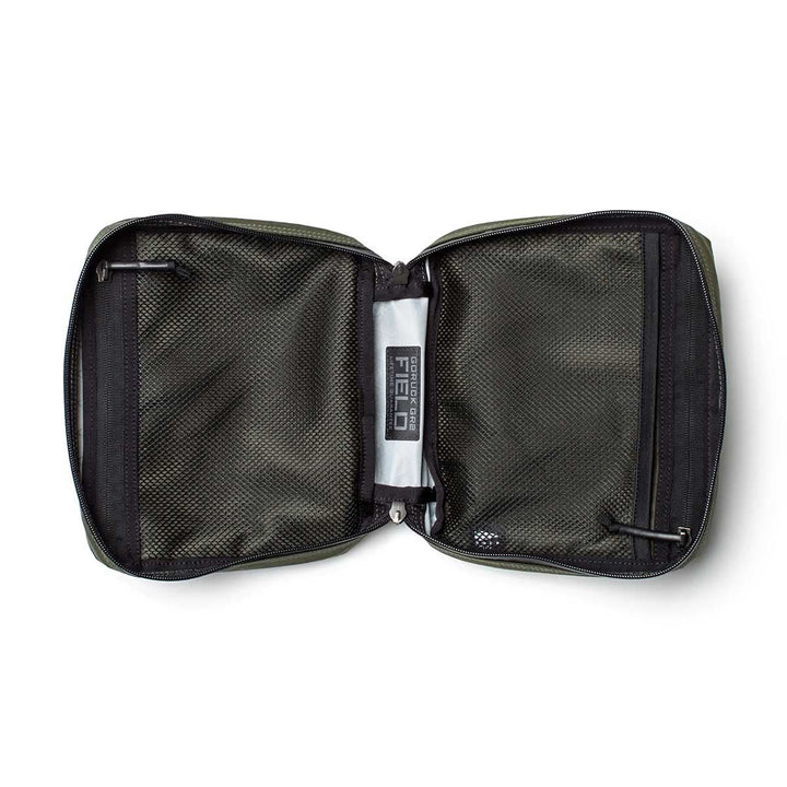 The GR2 Field Pocket - X-PAC is a green zippered pouch with black mesh pockets, a "Field" label inside, and durable waterproof fabric—ideal as an electronics organizer.
