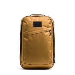 GORUCK tactical rucksack in coyote tan with diagonal zippered pocket and black patch on front
