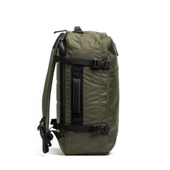 The GR3 - X-PAC olive green carry-on backpack stands upright in a side view, showing black straps and a handle; it includes a convenient laptop compartment.