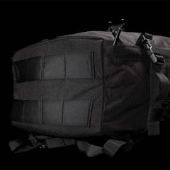 Close-up of a black GORUCK GR3 - Cordura tactical backpack against a dark background. The image highlights the rugged, water-resistant material and multiple straps, showcasing its durability and functional design as an ideal carry-on rucksack.
