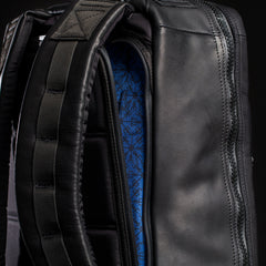 Close-up of the GR1 USA x Carryology - Berserker Viking backpack, showing its blue patterned interior and padded shoulder straps.