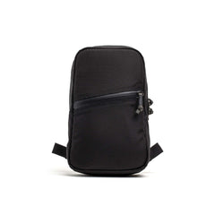 Compact black GORUCK Grenade pack with a diagonal zippered front pocket and durable fabric