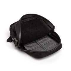 Open black GORUCK Grenade pouch with gray interior and durable zipper on white background