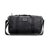 GORUCK black duffel gym bag with shoulder strap, durable rucking gear on white background