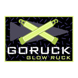 GORUCK Glow Ruck patch with neon glow sticks and arrow design on black pattern background