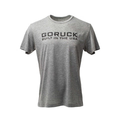 The GORUCK Built in the USA Tee - Tri-BlendX is a gray, short-sleeve premium tri-blend shirt featuring bold black "GORUCK BUILT IN THE USA" text on the front—ideal for everyday wear.