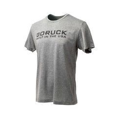 The GORUCK Built in the USA Tee - Tri-BlendX is a gray premium tri-blend shirt featuring bold black "GORUCK BUILT IN THE USA" print on the front, ideal for everyday wear. Shown on a white background.