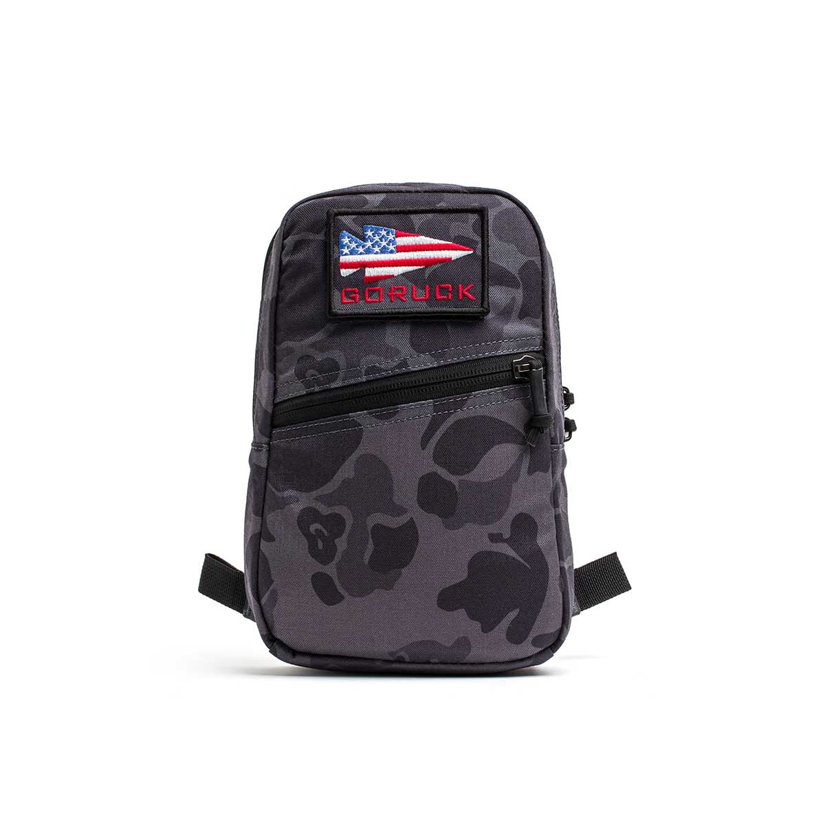 The Cordura GRenade is a small black and gray camo ruck bag made from tough 500D Cordura, featuring an American flag patch and 