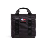 GORUCK black grocery tote bag with American flag patch and sturdy handles on white background