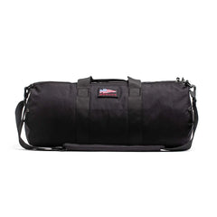 GORUCK 38L black gym bag with shoulder strap and American flag patch on white background