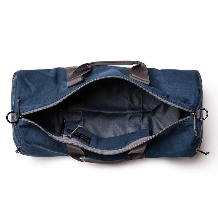 Top view of the Gym Bag - Cordura, showcasing its durable blue CORDURA fabric, gray handles, and sturdy zipper.