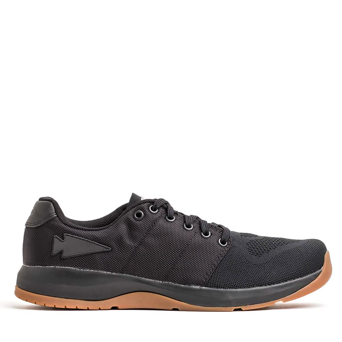 The GORUCK Men's Ballistic Trainers - HULK is a black athletic shoe ideal for functional fitness footwear enthusiasts. It features a mesh upper, lace-up design, and a contrasting brown rubber sole. This workout shoe also includes a subtle emblem on the side and is set against a plain white background.
