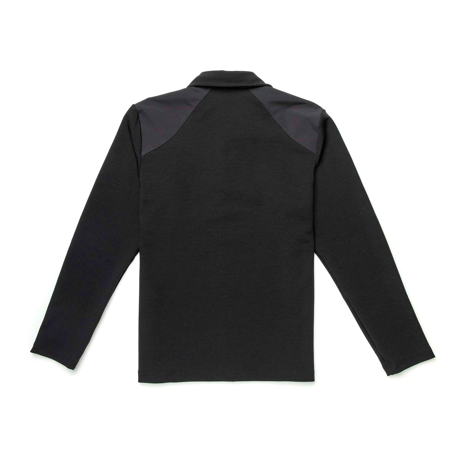 The Heavy Commando Shirt - Merino Wool is a black long-sleeve shirt with dark shoulder panels, shown flat from the back. It features moisture-wicking properties for all-day comfort.
