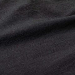 Close-up of black Heavy Merino rucking shirt fabric texture, GORUCK gear detail