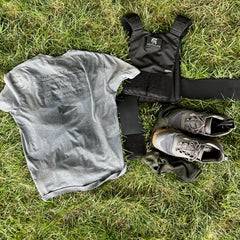 Three Rules Tee - Unisex Tri-BlendX in gray, black weighted vest, leggings, socks, and black shoes on grass—train or explore outdoors with cool style and confidence.